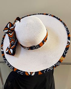 ombines timeless elegance with vibrant cultural flair. Handcrafted with care, this hat features a beautifully woven straw base adorned with bold African print fabric, offering both style and sun protection. Perfect for church services, outdoor events, or simply adding a touch of sophistication to your outfit, this hat blends tradition with modern design. Lightweight and breathable, it's as comfortable as it is striking. Elevate your look with a hat that celebrates heritage and craftsmanship. One size: should fit all. **** The straw hat color might vary from white to Beige. Adjustable White Fedora Straw Hat, White Straw Hat With Curved Brim, White Adjustable Boater Hat With Curved Brim, Adjustable White Boater Hat With Curved Brim, White Toquilla Straw Panama Hat For Summer, White Bohemian Brimmed Sun Hat, White Bohemian Wide Brim Boater Hat, White Toquilla Straw Hat With Curved Brim, White Brimmed Toquilla Straw Boater Hat