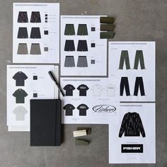 several pieces of paper with different types of clothing on them and a pen next to it