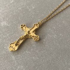 CROSS NECKLACE Stainless steel chain is used in this necklace. The pendant is 14K Gold plated. It is resistant to tarnishing. For other types of pilgrimage, please visit our shop! ☆ Delivery in 1-3 working days! ☆ We update the stock amount according to the custom of stones . If you contact us in case of bulk purchase or no stock, we will reply quickly.( stock is 100 pcs) If you are thinking of purchasing a product that will make you feel good, but if you have any questions about the product, we will help you. After purchasing the product, we follow your order closely and inform you in the process until the product reaches you. The product has arrived! It's yours now ! If there are ever any issues with the jewelry, please feel free to contact us with your concerns. Our team is dedicated to Gold Plated Crucifix Necklace Tarnish Resistant, Gold Plated Tarnish Resistant Crucifix Necklace, Gold-plated Tarnish-resistant Crucifix Necklace, Gold Metal Cross Charm Necklaces, Gold Cross Pendant Chain Jewelry, Gold Pendant Cross Necklace With Clavicle Chain, Gift Cross Necklace With Crucifix Chain, Gift Crucifix Cross Necklace With Chain, Gold Chain Necklace With Cross Pendant For Gift