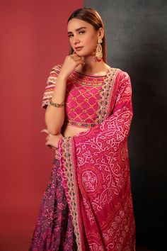 Purple attached can-can lehenga with all over patola pattern with beads and thread work waistband and hem. Paired with a pink padded kathiawadi embroidered blouse and bandhani dupatta.
Components: 3
Pattern: Woven, Embroidery
Type Of Work: Patola, Bandani, Kathiawadi
Neckline: Round Neck
Sleeve Type: Half Sleeves
Fabric: Silk
Color: Purple
Other Details: 
Lehenga:
Attached can-can
Kathiawadi border on hem
Length: 42 inches
Blouse:
Padded
Length: 14 inches
Dupatta:
Kathiawadi border
Approx. produ Festive Pre-draped Saree With Motifs For Reception, Bollywood Lehenga With Motifs, Navratri Bandhani Print Sharara For Reception, Multicolor Bandhani Print Pre-draped Saree For Wedding, Semi-stitched Bandhani Print Traditional Wear For Reception, Traditional Bandhani Print Saree For Reception, Traditional Bandhani Print Sets For Reception, Designer Wear Lehenga With Motifs, Festive Bandhani Print Anarkali Set For Reception