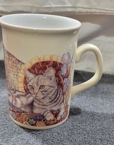 a coffee cup with a cat on it