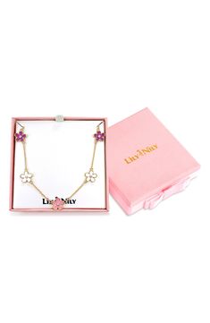 Your little flower enthusiast will bloom with this hand-painted station necklace featuring shimmering cubic zirconia. Adult supervision strongly recommended; jewelry presents choking hazard and should be removed when infant or small child is unattended 14" length ; 2" extender Goldtone plate/enamel/cubic zirconia Imported Pink Flower Necklace For Birthday Gift, Pink Cubic Zirconia Flower Pendant Necklace, Pink Flower Charm Jewelry For Mom, Pink Flower Charm Jewelry Gift For Mom, Pink Flower Charm Jewelry As Gift For Mom, Station Necklace, Girls Jewelry, Cubic Zirconia, Gold Tones