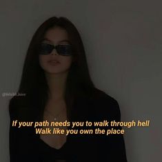 a woman wearing sunglasses with a quote on it