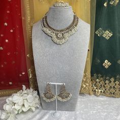 this stunnning antique gold necklace set designed with crystals and multicolour bead drops. It includes necklace, earrings and tikka. Please note, earrings has hook type back picture attached for reference.  Measurements necklace 2.5  inch wide & 3 inch length  earrings  2.5 length including drop x  1 inch wide  tikka 6 inch length x 2.5 inch wide  Ready to ship 📦 Back Pictures, Pearl Necklace Set, Gold Necklace Set, Set Design, Pakistani Fashion, Bridal Sets, Antique Gold, Necklace Set, Pearl Necklace