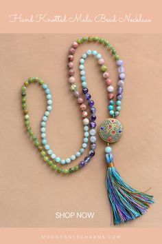 Hand Knotted Mala Bead Necklace. Express yourself more with this colorful Mala Necklace that will support your intentions and will gently remind you of them throughout your day. Check out our mala necklace collection and Get inspired by the meaning of the mala beads. Malas and meditation go hand in hand. They help you to enhance your spiritual practices. We offer a great variety of prayer beads, meditation tools, Japa mala 108 beads, and 27. Check our website to see more> Holistic Mala With 108 Beads For Festival, Multicolor Spiritual Long Beaded Necklaces, Multicolor Spiritual Long Beaded Necklace, Traditional Beaded Necklaces For Meditation, Beaded Amulet Mala For Meditation, Beaded Mala Amulet For Meditation, Handmade Amulet Mala For Meditation, Traditional Mala With Natural Stones For Meditation, Holistic Necklaces With 8mm Beads For Festivals