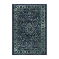 a blue rug with an ornate design on the front and back side, in dark green tones