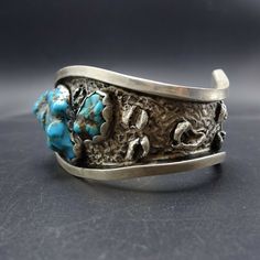 ". VINTAGE STERLING SILVER and TURQUOISE BRACELET DESCRIPTION: Heavy gauge sterling silver with a reticulated finish and three gorgeous specimens of blue turquoise set in scalloped bezel. This bracelet will be a cherished addition to your collection of fine vintage Southwestern and Native American jewelry. MEASUREMENTS: Interior of the cuff measures 5 3/4\" with an additional 1 3/8\" non-adjustable gap. Total circumference: 7 1/8\" Measures 2 5/8\" straight across the widest part (from wrist bon Jewelry Measurements, Bones Bracelet, Turquoise Bracelet Cuff, Turquoise Cuff, Gorgeous Bracelet, Coral Turquoise, Denver Co, American Jewelry, Green Turquoise