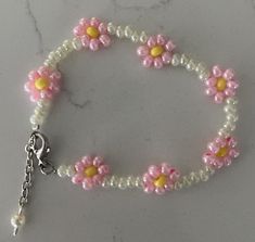 Hand Beaded dainty unique white/pink coloration glass bead bracelet.  Great gift to give or for yourself!  Fun to wear or give!  Perfect for daughter or granddaughter!  Adjustable length up to 7.5" Each bracelets is unique & individually handcrafted. Handmade White Pearl Bracelet For Friendship, Pink Round Beaded Bracelets For Birthday, Handmade White Pearl Bracelet, Cute Handmade White Pearl Bracelet, Cute White Handmade Pearl Bracelet, Pink Beaded Bracelets With 8mm Beads For Birthday, Adjustable Pink Pearl Bracelet Gift, Cute Adjustable White Pearl Bracelet, Handmade White Pearl Bracelet With Flower Shape