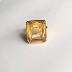 A vintage 9 carat gold ring, displaying a gorgeous and rather large citrine. The stone is held by a simple gold setting that frames the stone perfectly, holding it high up on display. CONDITION: Good condition, wear consistent with age and use. Please see photos for more detail. Scratches to the face. MARKED 9 CARAT GOLD  BAND WIDTH: 2mm SETTING HEIGHT: 10mm STONE FACE: 16mm X 19mm RING SIZE: UK: N 1/2 | US: 7 WEIGHT: 9.2grams (DZZ) Gold Diamond Band, Gold Signet Ring, Gold Engraving, Aquamarine Rings, Vintage Ring, Gold Set, Gold Band, Statement Ring, Rings Statement