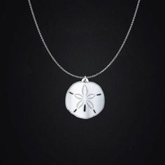 This sterling silver sand dollar necklace is a beautiful reminder of the ocean waves and summer days at the beach all year long.  General Information: It has an incredible shine that you will love every time that you look at it. Charm comes in four sizes: - 3/4in (20mm) - 1in (24mm) - 1.18in (30mm - 1.5in (38mm) Chains come in two lengths: - 18in (45cm) - 20in (50cm) Charms are a sturdy and thick .036in (0.9mm), 20 gauge sterling silver. Chains are a .047in 45.00(1.2mm) thickness Italian sterlin Ocean-inspired Sterling Silver Beach Jewelry, Sterling Silver Pendant Jewelry For Beach, Starfish Charm Strand Jewelry For Beach Season, Starfish Charm Necklace For Beach Season Gift, Silver Charm Necklace For Beach, Silver Charm Necklaces For Beach, Starfish Necklace For Beach Season Gift, Starfish Shaped Jewelry For Beach Season Gift, Starfish Jewelry For Beach Season Gift