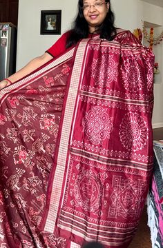 ✨This 8 ply master piece is woven ikkat (bandha) pure silk saree in maroon color..The saree depicts people celebrating festival with dance, Mrudang,trees and other nature inspired motifs in the body. The Anchal is very gorgeous and have various Jhoti (Rangoli) designs that are used in Odisha. Both side of the saree have rudraksh border.  ✨ Comes with fall pico stitched and an unstitched blouse piece. 👉Sambalpuri Sarees of Odisha are known as the finest handloom.  👉The sarees reflect an original style of craft known as Baandha (Ikat) Traditionally. 👉These Baandhas are hand weaved with images of flora or fauna or with geometrical patterns or temple inspired motifs.  💫Adorn elegance in this gorgeous Sambalpuri Ikat pure silk saree from us.  Note- Slight variation in color possible due to Red Tussar Silk Pre-draped Saree With Motifs, Navratri Handloom Silk Pre-draped Saree, Handloom Silk Pre-draped Saree For Navratri, Navratri Silk Handloom Pre-draped Saree, Festivals Cotton Silk Saree With Traditional Patterns, Festival Cotton Silk Saree With Traditional Patterns, Navratri Katan Silk Pre-draped Saree For Puja, Navratri Puja Katan Silk Saree, Raw Silk Saree For Puja And Navratri