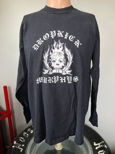 "True vintage Dropkick Murphys Fire & Brimstone longsleeve t-shirt from 1998. Size large single stitched tee in good shape, couple of tiny holes on the front. Measures 21.5\" pit to pit, 25.5\" collar to bottom." Dropkick Murphys, Great T Shirts, True Vintage, Gender Neutral, Graphic Tees, Bathing Beauties, Adult Outfits, T-shirt, Top Outfits