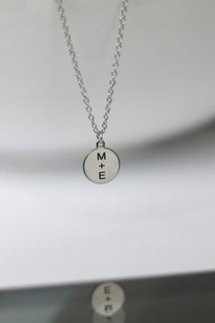 Initial necklace for men - chain necklace with a silver tone disc pendant with the engraving of your choice. Personalized necklace for men - engrave any word, letter or symbol. This necklace would make a great custom gift for birthday, anniversary or any occasion. Please write your engraving request at the 'Personalization' section before checkout.  Clasp closure.  Chain material: stainless steel (waterproof) Charms material: stainless steel (waterproof) Chain thickness: 2mm Pendant size: 1.5 cm Silver Medallion Necklace For Anniversary Gift, Personalized Sterling Silver Charm Necklace For Father's Day, Father's Day Personalized Sterling Silver Charm Necklace, Sterling Silver Charm Necklaces For Father's Day, Silver Stamped Necklaces For Anniversary Gift, Silver Hand Stamped Necklace For Best Friend, Silver Stamped Necklace For Anniversary Gift, Engraved Sterling Silver Charm Necklaces For Father's Day, Father's Day Engraved Sterling Silver Charm Necklaces