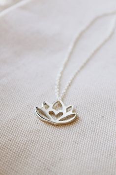 An original Lola&Cash protea necklace featuring a hidden heart— d e t a i l s —-protea measures 2cm wide-hand sawn out of solid sterling silver-completed in a mirror finish-includes a 45cm chainThis pendant is also available in gold as seen in last picturehttps://www.etsy.com/listing/621948340/gold-protea-pendant-solid-9ct-yellow?ref=shop_home_active_1-All Lola&Cash jewellery will arrive gift wrapped>>>——————————<<<>>>——————————<<<Please Note - Made to order - Rush orders can be accommodated upo Elegant Lotus Flower Jewelry Gift, Nature-inspired Silver Heart Necklace, Spiritual Lotus Flower Necklaces For Gifts, Delicate Silver Necklace For Meditation, Spiritual Lotus Flower Necklace Gift, Delicate Small Jewelry Gift, Small Minimalist Necklace As A Gift, Delicate Jewelry For Gifts, Small Minimalist Necklace Perfect For Gifts