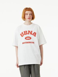 This basic T-shirt is simply detailed with bold contrasting color UBNA logo graphic print. It has a trendy oversized fit, and is made from durable and soft single cotton jersey.- Ribbed crew neck- Graphic print at front- Short sleeves- Oversized fit- Unisex wear- Durable double stitching at neck and shoulder line- Tentar and tumble finish to minimize shrinkage and wrinkles- Easy care and comfortable high density 16's single cotton jersey Collegiate Crew Neck T-shirt For Streetwear, Oversized Screen Print T-shirt For College, College Crew Neck T-shirt With Branding, Oversized Graphic Print T-shirt For College, Collegiate Graphic Print Crew Neck T-shirt, Collegiate Crew Neck T-shirt With Graphic Print, Collegiate Style Screen Print T-shirt For Streetwear, Collegiate Graphic T-shirt For Streetwear, Collegiate Streetwear T-shirt With Graphic Print