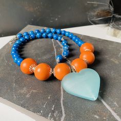 - Blue Puffy Heart Pendant Choker: A bold statement piece featuring a large, soft-textured heart pendant, ideal for adding a touch of romance to any outfit. - Orange Huge Bead Jewelry: Vibrant and eye-catching, these oversized beads make a daring statement, perfect for those who love to stand out. - Maximalist Jewelry: Embracing the 'more is more' philosophy, this style is for the bold and the fearless, featuring large, colorful pieces that command attention. - Blue Jasper Statement Necklace: Kn Blue Heart Beaded Necklaces, Handmade Blue Beaded Necklaces With Heart Pendant, Blue Handmade Beaded Necklaces With Heart Pendant, Handmade Blue Beaded Necklace With Heart Pendant, Blue Beaded Necklace With Heart Pendant, Blue Heart Beads Heart-shaped Necklace, Blue Heart Beads Heart Necklace, Blue Heart Beads Necklace In Heart Shape, Blue Heart-shaped Necklaces With Heart Beads