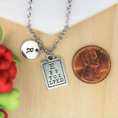 ♥ Eye Care Necklace Silver Eye Chart Charm Necklace Vision Pendant Eye Doctor Charms Optometry Jewelry Initial Necklace Eye Doctor Gift Monogram ♥ This is a beautiful Eye Care charm with hand stamped initial charm on a stainless steel chain, You able to choose initial from a drop down menu, ♥ You will receive 1 necklace ♥ Eye Doctor charm19x10 mm ♥ Initial charm 10 mm choose from a drop down menu ♥ Stainless steel chain 18 inches ♥ additional initial https://www.etsy.com/listing/766732811 If you Personalized Vintage Metal Jewelry, Vintage Personalized Charm Necklaces As Gift, Personalized Vintage Charm Necklaces As Gift, Personalized Vintage Charm Necklaces For Gift, Silver Jewelry With Lobster Clasp For Best Friend Gift, Personalized Rectangular Metal Jewelry, Adjustable Hand Stamped Metal Necklace, Stamped Metal Necklaces For Gifts, Vintage Necklace With Charms For Personalized Gift