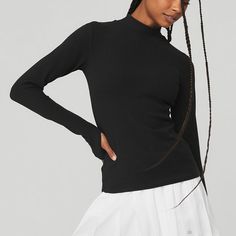 Wellness Rib Mock Neck Long Sleeve - Black | Alo Yoga Modern Funnel Neck Top For Fall, Black Ribbed Tops For Fall, Second-skin High Neck Top For Fall, Sleek Black Mock Neck Top For Fall, Alo Yoga Fitted Tops For Fall, Black High Stretch Funnel Neck Top, Fitted Alo Yoga Top For Fall, Versatile Ribbed Top For Winter, Versatile Ribbed Turtleneck Tops