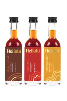 three bottles of hot sauce with labels on the front and back, each containing different flavors