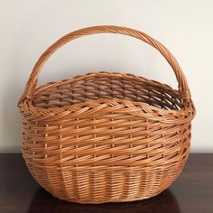 A real beauty, this rustic mid-20th century market basket features intricate handwoven designs, a braided rim, and French randing at the bottom. It is a sturdy, tall, and deep basket, making it perfect for carrying larger fruits and vegetables, as well as wine and other bottles. Also doubles as a lovely display piece.  Basket interior measures roughly 15” (w) x 9”(d) x 10” (h). Basket Reference, Basket Making, Berry Baskets, Market Basket, Crochet Boots, Hand Woven Baskets, Market Baskets, Cozy Room Decor, Red House