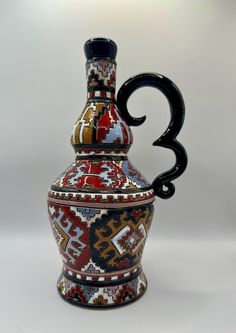 a decorative vase with the number three on it's side and an ornamental design