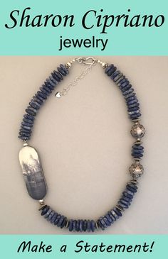 One-of-a-kind sodalite and silver statement necklace featuring handcrafted art bead. Handmade Kyanite Healing Necklaces, Handmade Artisan Rondelle Beads, Handmade Rondelle Artisan Beads, Lapis Lazuli Rondelle Gemstone Beads Jewelry, Handmade Spiritual Rondelle Necklace, Hand-strung Silver Artisan Beaded Necklace, Spiritual Handmade Rondelle Necklace, Artisan Jewelry With Rondelle Gemstone Beads, Artisan Jewelry With Large Rondelle Beads