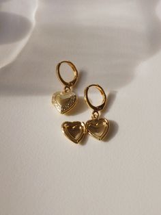 Gold Open Heart Huggie Earrings For Anniversary, Gold-tone Huggie Earrings Gift, Gold Heart Huggie Earrings Gift, Gold Double Heart Huggie Earrings Gift, Gold Huggie Earrings With Heart Charm Gift, Gold-plated Huggie Earrings With Charms, Gold Double Heart Huggie Earrings, Gold Plated Huggie Earrings With Charms, Gold Huggie Earrings With Heart Charm