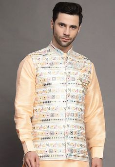 Art Silk Nehru Jacket in Light BeigeThis Readymade Sleeveless attire is Enhanced with Buttons, Mirror Effect and Resham Work. Crafted in Chinese Collar NeckDo note: Brooch and Kurta shown in the image is for presentation purposes only. Half to one inch may vary in measurement. (Slight variation in actual color vs. image is possible) Mens Kurta | Mens Kurta Pajama | Mens Sherwani | Mens Sherwani Sets | Traditional Menswear | Partywear Menswear | Indian Mens Dresses | Diwali Kurta | Kurta Pajama | Spring Chanderi Nehru Jacket With Resham Embroidery, Spring Resham Embroidery Chanderi Nehru Jacket, Spring Nehru Jacket With Resham Embroidery In Chanderi, Designer Sleeveless Embroidered Nehru Jacket, Sleeveless Embroidered Nehru Jacket For Designer Wear, Sleeveless Nehru Jacket With Zari Work For Transitional Season, Spring Embroidered Chanderi Sherwani, Festive Sleeveless Nehru Jacket With Resham Embroidery, Sleeveless Embroidered Bandhgala For Festive Season