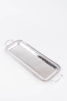 an empty silver tray on a white background