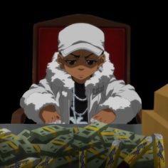 a person sitting at a table with stacks of money