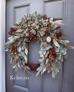 a wreath is hanging on the front door