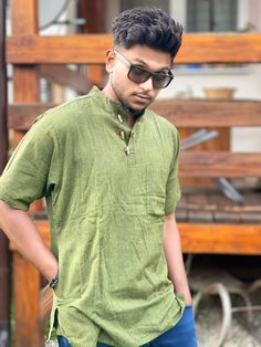 This handwoven khadi cotton shirt inspired by the Indian kurta, is stylish and elegant. It features a pocket on the left side and it closes by three wooden buttons. This shirt is free from the dictates of mass production being handmade in a small  workshop using exclusively local high quality khadi cotton. It is exotic but at the same time classical and elegant. This item  is handwoven an handmade so it may present minor irregularities which give to the product it's particular beauty. For the sa Khadi Shirts Men, Casual Cotton Kurta With Relaxed Fit, Casual Cotton Tunic Shirt, Green Cotton Silk Kurta For Summer, Relaxed Fit Cotton Shirt With Natural Dye, Casual Cotton Tunic Kurta, Handloom Cotton Fabric For Festivals, Casual Cotton Kurta With Half Sleeves, Casual Cotton Kurta With Short Sleeves