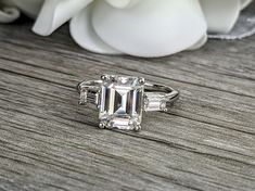 an emerald cut diamond ring with baguettes