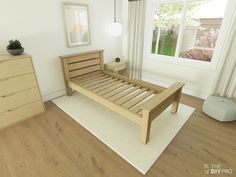 a bed room with a neatly made bed next to a dresser and a large window