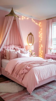 a bedroom with pink walls and lights on the ceiling is decorated in shades of pink