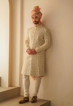 Editor's Note Ivory Sherwani With Jaal Hand Embroidery, Paired With Old Rose Ombre Stole, Ivory Kurta And Churidar Fabric: Linen Silk Color: Ivory Component: Sherwani, Kurta, Churidar, Stole, Safa Care: Dry Clean Only About the Designer After establishing himself as the leading couturier in the industry of menswear, Jatin Malik went on to explore luxury footwear. You can order online these amazingly designed handmade shoes that are being offered in classy Caligae and Peshawari patterns! We recog Embroidered Straight Kurta Bandhgala For Reception, Bollywood Style Off-white Straight Kurta, Reception Sherwani With Cutdana And Long Sleeves, Long Sleeve Sherwani With Cutdana For Reception, Gold Sherwani With Chikankari Embroidery, Long Sleeve Sherwani With Chikankari Embroidery For Diwali, Festive Off White Kurta With Cutdana, Off White Chikankari Embroidery Sets For Reception, Cream Churidar For Reception