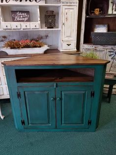 a kitchen island made out of an old cabinet