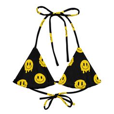 Hit the festival grounds in standout style with the Trippie Bikini Top. Splashed with a vibrant yellow and black smiley design, this top is all about comfort as you enjoy the music and vibes. •Its eco-friendly recycled fabric and UPF 50+ protection ensure you're all set for those sun-soaked festival days. • Adjustable Comfort: Crafted with flexible straps, find your perfect fit and style it. • Soft & Stretchy: The material moves with you so that you can dance and groove without a care. • Inclusi Playful Festival Swimwear, Playful Summer Festival Swimwear, Rave Festival Triangle Top Swimwear, Rave Festival Swimwear With Triangle Top, Fun Festival Swimwear With Triangle Top, Fun Graphic Print Swimwear For The Beach, Fun Triangle Top Swimwear For Festivals, Rave Swimwear For Summer Vacation, Fun Graphic Print Swimwear For Beach