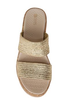 Treat yourself to the resort-ready comfort of this playful slide sandal featuring a duo of playful, woven straps and a chunky wedge heel. An air-infused outsole keeps your stride light and bouncy as the cushy, anatomical footbed cradles each step. Lightweight: puts cushioning and performance underfoot with an emphasis on streamlined comfort Cushioning: absorbs impact and distributes weight for consistent, buoyant comfort under each step 2 1/4" heel; 1" platform Treated with antimicrobial technol Summer Slide Wedge Sandals With Cushioned Footbed, Gold Synthetic Slide Sandals, Casual Gold Slides For Vacation, Beach Slide Wedge Sandals With Textured Sole, Summer Slide Wedge Sandals In Synthetic Material, Beach Wedge Slide Sandals With Textured Sole, Beach Wedge Sandals With Textured Sole And Slide Shape, Synthetic Slide Wedge Sandals With Textured Sole, Gold Synthetic Slides For Beach