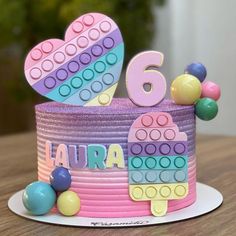 a birthday cake that is decorated with legos and numbers on it's side