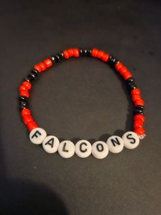 Atlanta Falcons Beeded Bracelet.  NFL football themed Avaliable in multiple colors, size. Team-colored Sports Bracelets With Letter Beads, Team-colored Bracelets With Letter Beads For Sports, Team-colored Letter Beads Bracelets For Sports, Casual Beaded Bracelets In Team Colors For Sports Events, Casual Team-colored Beaded Bracelets For Sports Events, Sporty Beaded Bracelets For Sports Events, Team-colored Bracelets For Sports, Casual White Bracelets For Team Events, Personalized Black Sporty Bracelets