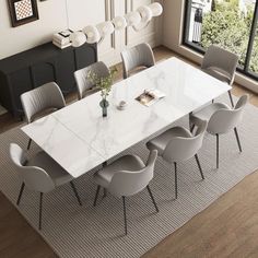 a dining room table with chairs around it