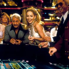 the actors are playing roulejack in front of other people at a casino table