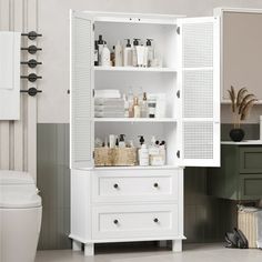 a white bathroom cabinet with lots of bottles on it's shelves next to a toilet