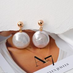 These elegant earrings feature natural round, flat baroque pearls, each uniquely shaped, adding a touch of individuality and charm. Set in 925 sterling silver, these earrings are perfect for bridesmaid gifts or special occasions. Their minimalist design makes them versatile enough for everyday wear, while the lustrous pearls create a timeless and sophisticated look. A thoughtful gift for her, these earrings beautifully capture the essence of understated elegance. DETAILED DESCRIPTION// Material: Formal Drop Earrings With Baroque Pearls, Pearl White Earrings With Pearl Chain As Gift, Pear-shaped Pearl Earrings Gift, Formal Dangle Earrings With Baroque Pearls, Party Pearl Pendant Earrings, Pear-shaped Pearl Earrings As Gift, Bridal Baroque Pearl Drop Earrings As Gift, Gift Pearl Earrings With Pearl Charm, Baroque Pearl Earrings With Pearl Pendant For Party