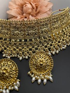 This is a beautiful antique gold choker set with matching earrings and comes with pearl details. It can be worn fir a statement look or complete bridal set as well. Authentic Indian, Bollywood Jewelry, Bridal Jewellery Indian, Gold Choker, Traditional Jewelry, Gold Set, Indian Bridal, Bridal Sets, Indian Jewelry