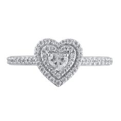 Steal her heart with the romantic details of this charming diamond engagement ring. Crafted in cool 10K white gold, this look showcases a 1/6 ct. heart-shaped diamond sparkling in a double diamond-lined frame. The shank shimmers with diamonds while hidden bezel-set diamonds adorn the gallery. Captivating with 1/2 ct. t.w. of diamonds and a bright polished shine, this engagement ring suits her sweet style. Diamond Heart Ring With Halo Design, White Heart Ring With Diamond Accents, Heart Shaped Engagement Rings, Double Frame, Double Diamond, Bezel Set Diamond, Heart Shaped Diamond, Loose Stones, Sweet Style