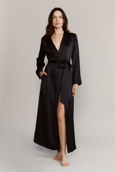 The Matador robe has an elegant elongated silhouette that drapes effortlessly. Made with 19mm silk satin and accented with tonal piping. Use the detachable belt to cinch the waist. Slip it on over the matching pajamas. 100% Silk Satin Cold water wash / hang dry Slim fitting Shawl collar Self-belted wrap closure with button and internal self-tie Long sleeve with vented cuff Model is 175cm / 5'9" and is wearing a Small Evening Robe With Satin Finish, Long Evening Robe With Satin Finish, Elegant Fitted Long Sleeve Sleepwear, Chic Fitted Silk Sleepwear, Fitted Silk Robe For Loungewear, Silk Fitted Robe For Loungewear, Chic Satin Evening Sleepwear, Chic Silk Robe For Sleeping, Luxury Fitted Long Sleeve Robe