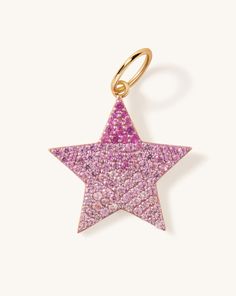 Bring a touch of magic to your style with our Gemstone Star Necklace Charm. This shining gemstone star will elevate your mood and your stack, it's a a win-win. Details:14k solid goldAverage pink sapphire weight is 1.03ctAverage blue sapphire weight is 0.91ctRound bail diameter: 8mmCharm dimensions: 19 x 20mmCHARM ONLY Shipping & Returns: Orders can be cancelled only within the first 24 hours. Most of our pieces are made to order, please allow 4-7 weeks for production. Free exchanges or returns for store credit within 7 days of receipt of the delivered package. All of our packages require signature at delivery to ensure your pieces get to you properly. When in doubt please email us at hello@sparklesociety.com Fine Jewelry Star-shaped Gemstone, Star-shaped Gemstone Fine Jewelry, Star Shaped Gemstone Fine Jewelry, Fine Jewelry Star Shaped Gemstone, Pink Star-shaped Sterling Silver Jewelry, 14k Gold Star-shaped Gemstone Jewelry, Pink Star Charm Pendant Jewelry, Diamond Starburst Jewelry With Star Charm, Starburst Diamond Jewelry With Star Charm