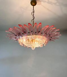 a chandelier hanging from the ceiling in a room